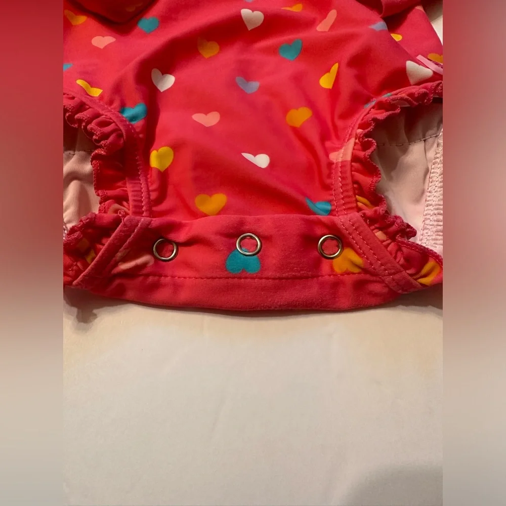 12-18M Ruffle Butts Coral Pink Heart Print Rash Guard